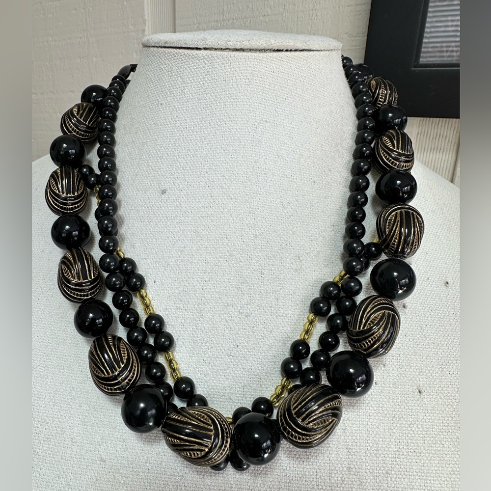 Triple strand black and gold bead necklace